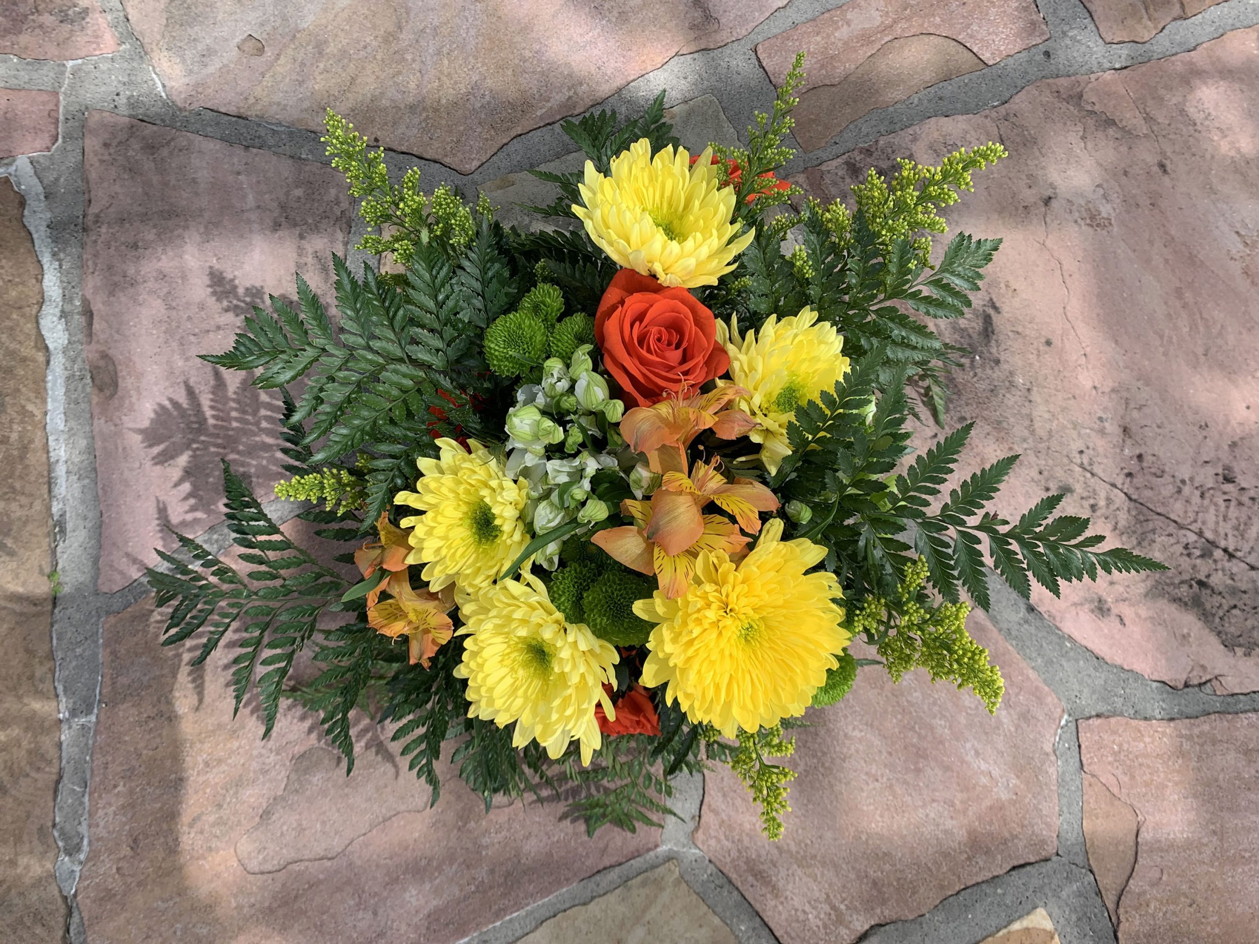 Yellow, orange, and green flower arrangement